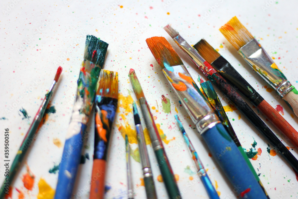 Obraz premium Colorful background of paint brushes, close up 