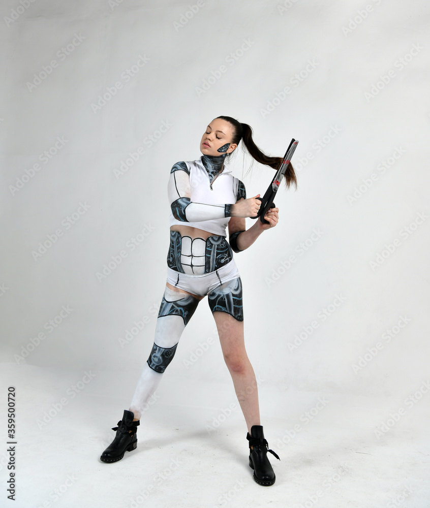 beautiful girl in a robot suit plays with scissors and hair beautiful girl in a robot suit plays with scissors and hair