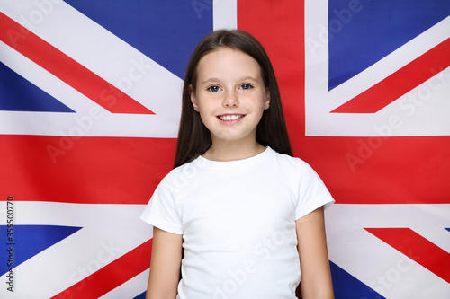 Young beautiful girl on british flag background