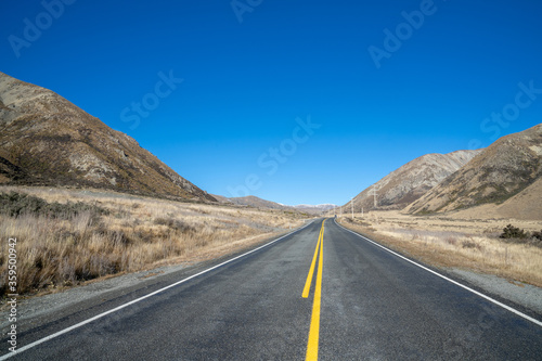 Beautiful highway road with mountain in rural on day time.