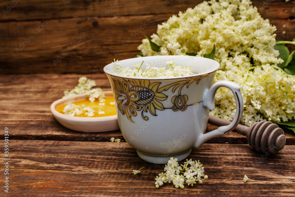 Tea from fresh elder flowers. Hot drink, honey, alternative medicine Tea from fresh elder flowers. Hot drink, honey, alternative medicine