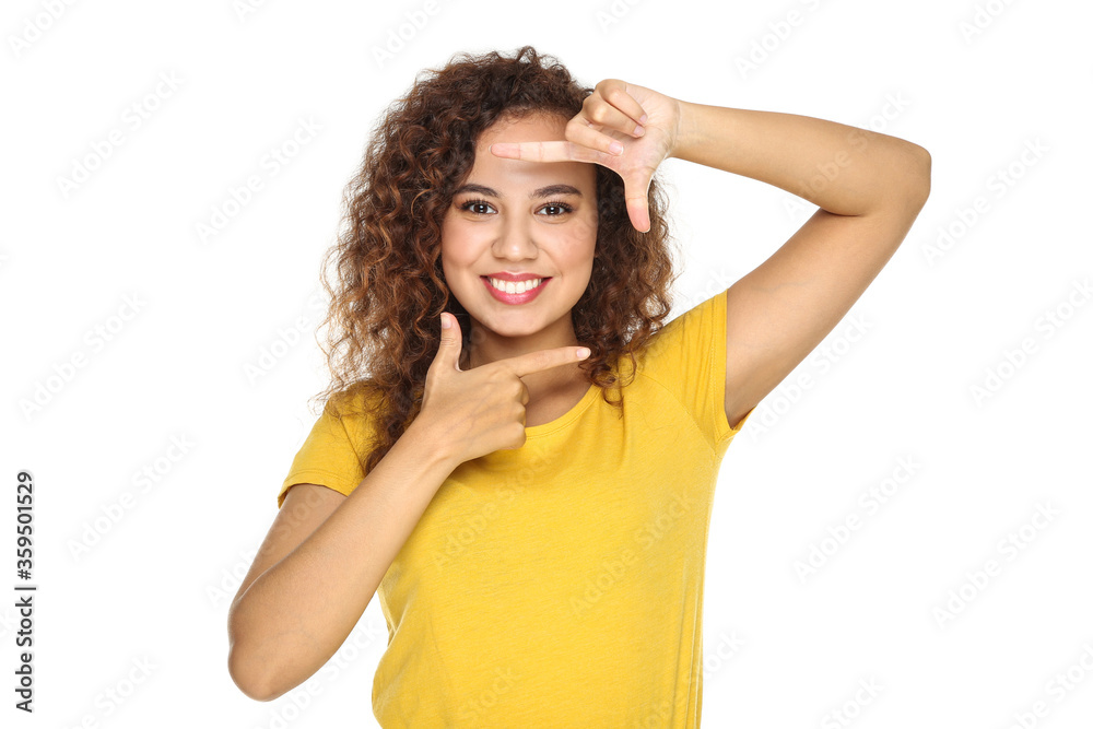 Young american girl showing photo frame by figners on white background
