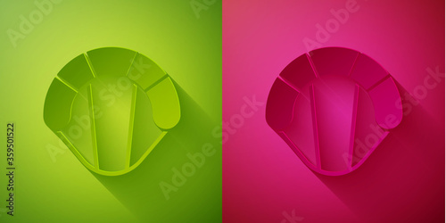 Paper cut Parachute icon isolated on green and pink background. Extreme sport. Sport equipment. Paper art style. Vector Illustration