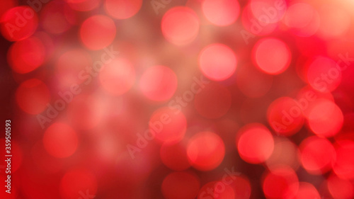 Red colored defocused bokeh lights background - horizontal wallpaper, poster. Stylish, festive and elegance shot. Trendy colors. Illuminated, lights, glitter effects. Celebrative decoration.