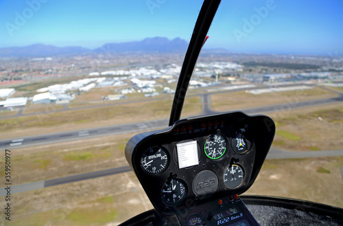 Cape Town, Western Cape / South Africa - 02/23/2016: Helicopter pilot's view of Cape Town International Airport with Table Mountain in the background