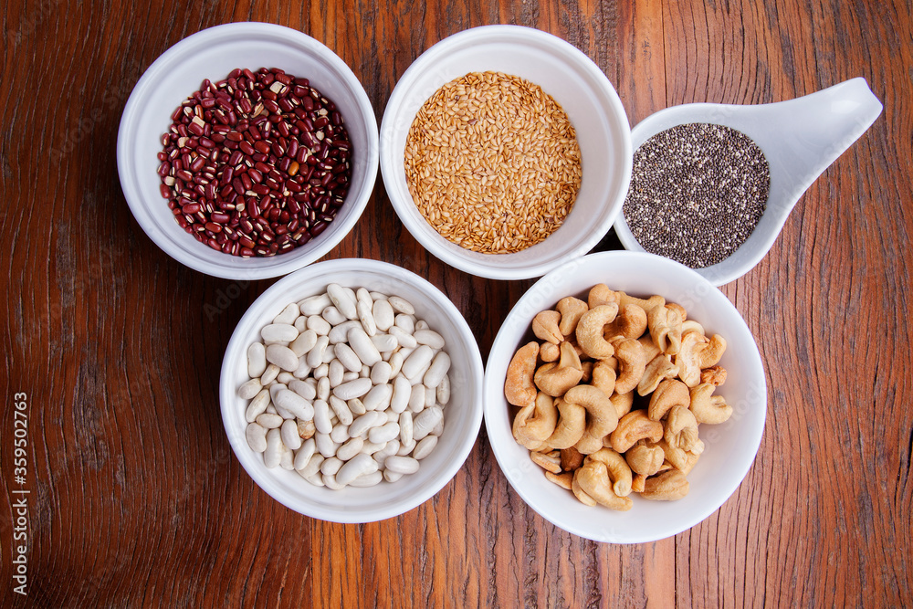 Nutrition concept -Healthy grains food selection in round bowls over wooden background. Healthy food, Diet, Detox, Clean Eating or Vegetarian concept Nutrition concept -Healthy grains food selection in round bowls over wooden background. Healthy food, Diet, Detox, Clean Eating or Vegetarian concept