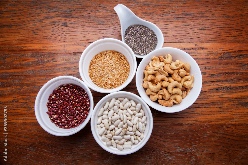 Nutrition concept -Healthy grains food selection in round bowls over wooden background. Healthy food, Diet, Detox, Clean Eating or Vegetarian concept Nutrition concept -Healthy grains food selection in round bowls over wooden background. Healthy food, Diet, Detox, Clean Eating or Vegetarian concept