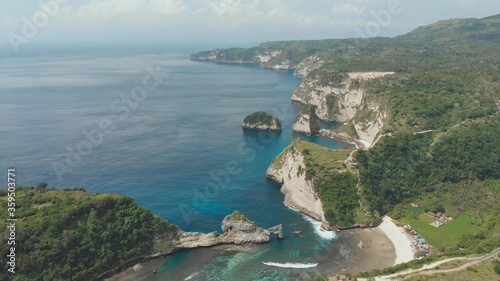 Aerial view of the small island of Nusa Penida Island from the Atuh Rija Lima shrine on Nusa Penida Island near Bali, Indonesia. Nusa Penida island aerial view beach from drone.
