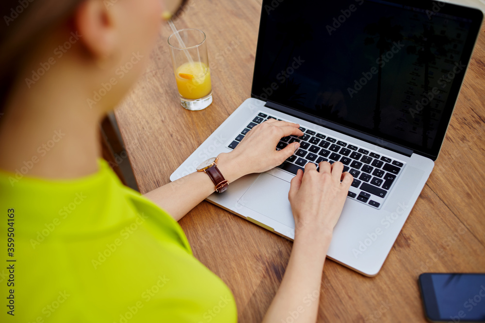 Creative female freelancer sitting front laptop computer with blank copy space screen for your information, young business woman work on netbook typing text during breakfast in modern coffee shop Creative female freelancer sitting front laptop computer with blank copy space screen for your information, young business woman work on netbook typing text during breakfast in modern coffee shop