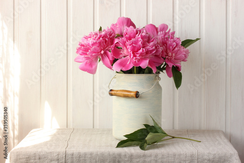 Fototapeta Naklejka Na Ścianę i Meble -  bouquet of pink garden peonies in a can.