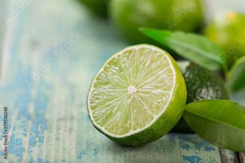 Fresh limes cut in half on ...