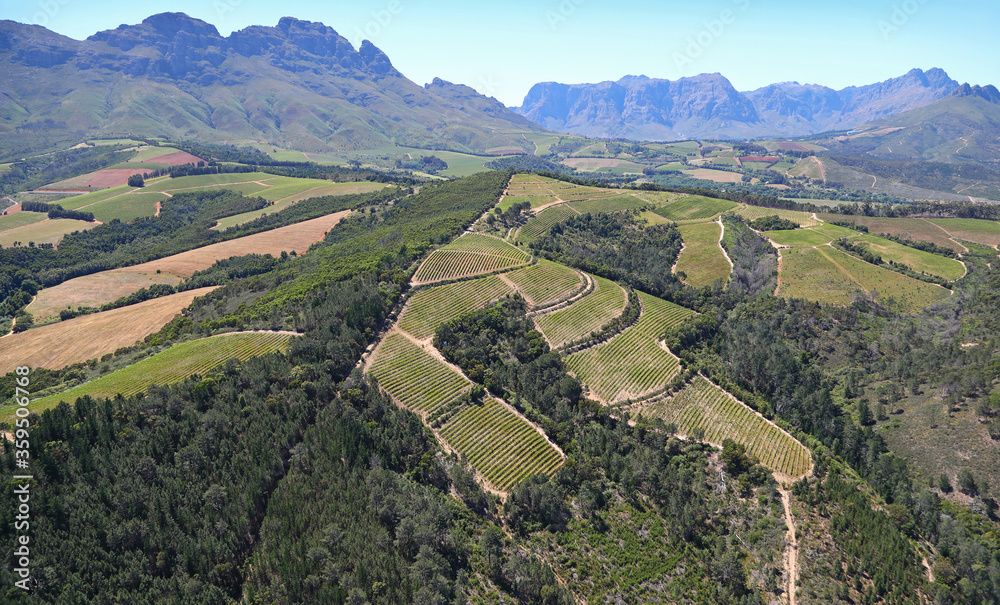 Cape Town, Western Cape / South Africa - 10/31/2019: Aerial photo of Stellenbosch vineyards and mountains