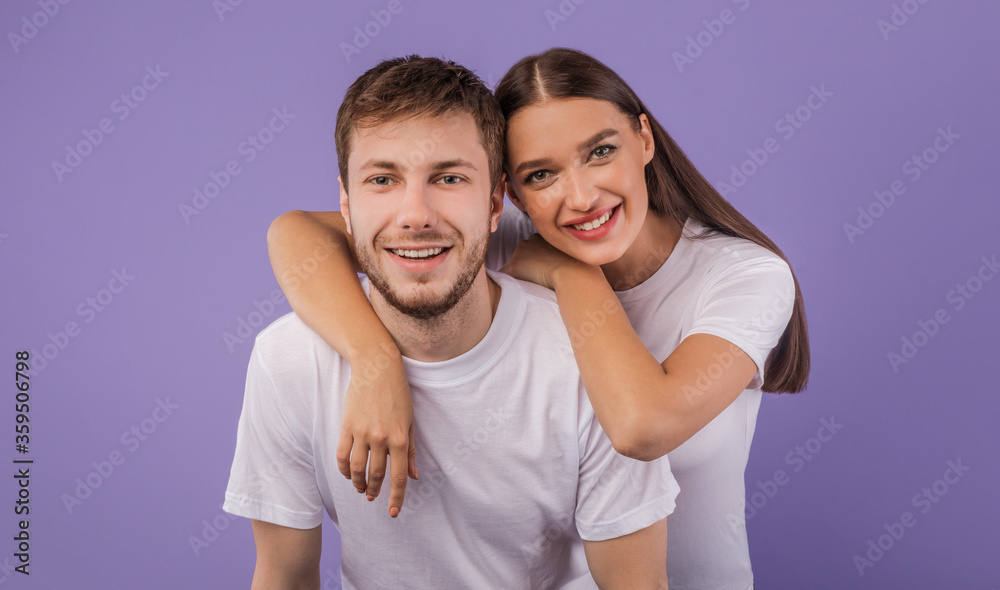Portrait of beautiful young couple smiling at studio Portrait of beautiful young couple smiling at studio