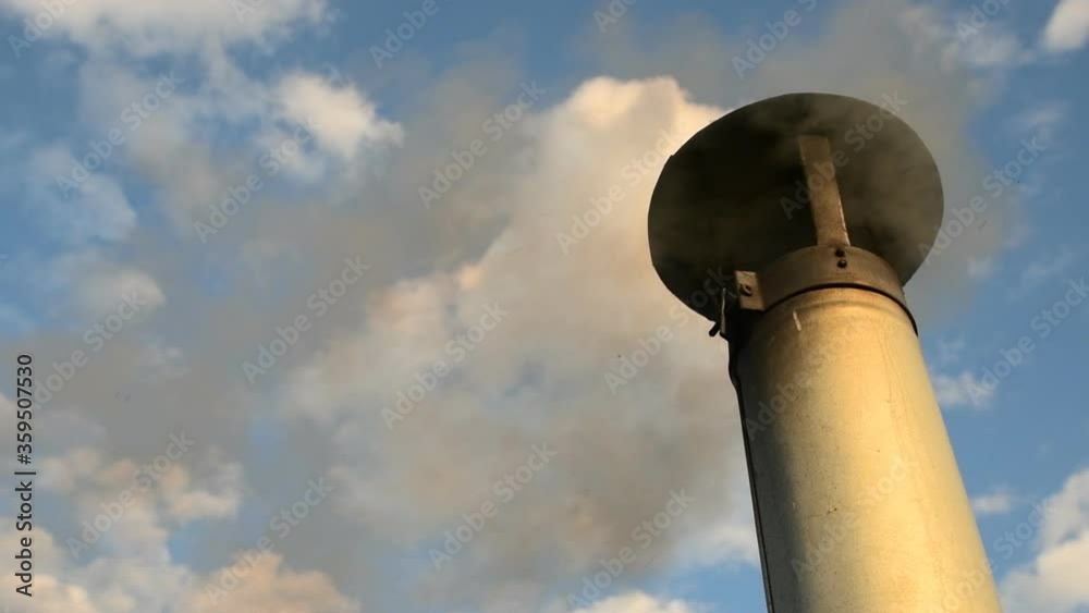 Smoke from a pipe from which soot particles fly out. Slow motion. Smoke from a pipe from which soot particles fly out. Slow motion.
