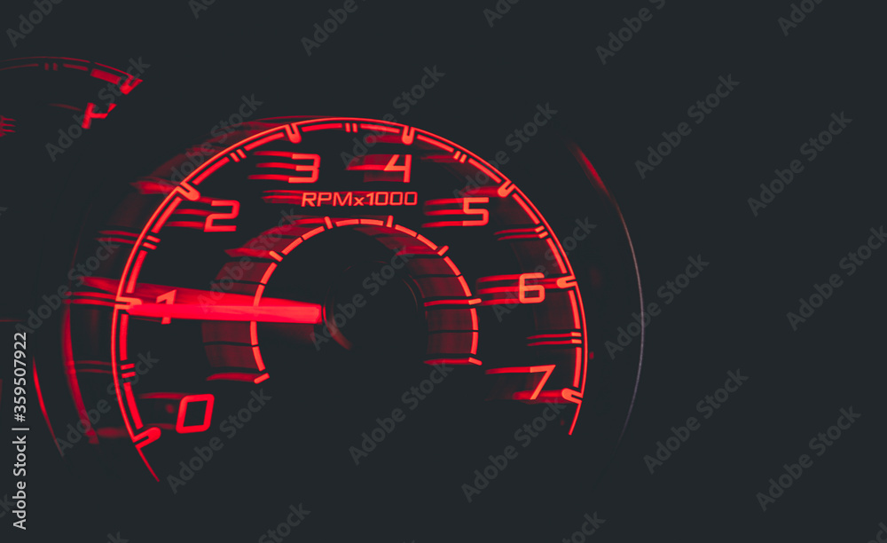 Driver's cockpit ; speedometer on dashboard - colorful light in black, copy space for your abstract design	