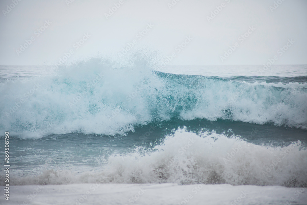 wild windy waves in the Atlantic ocean, with the white foam and splashes wild windy waves in the Atlantic ocean, with the white foam and splashes