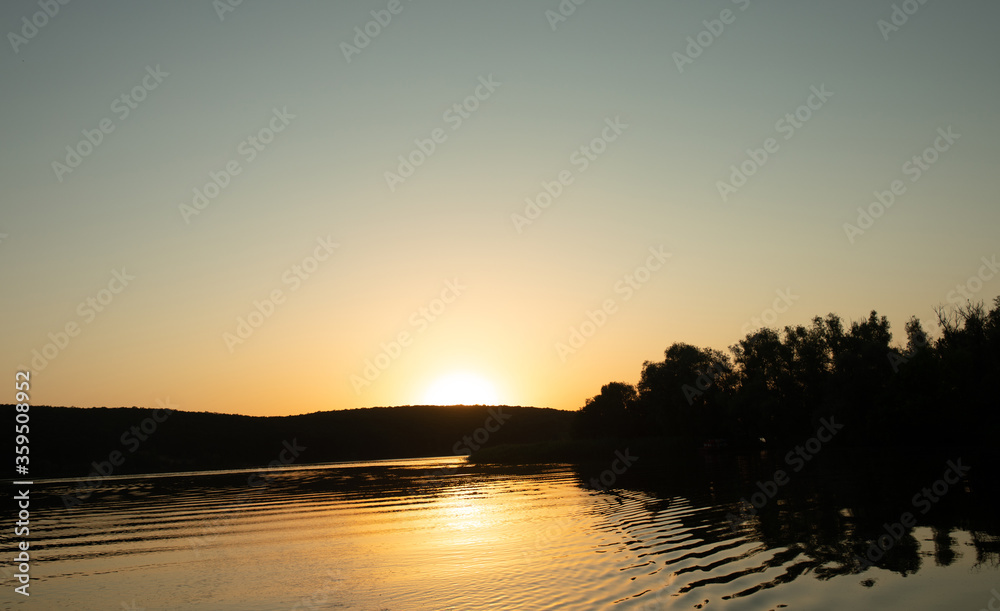 Beautiful sunset reflected in the lake.