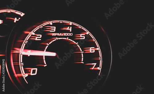 Driver's cockpit ; speedometer on dashboard - colorful light in black, copy space for your abstract design	