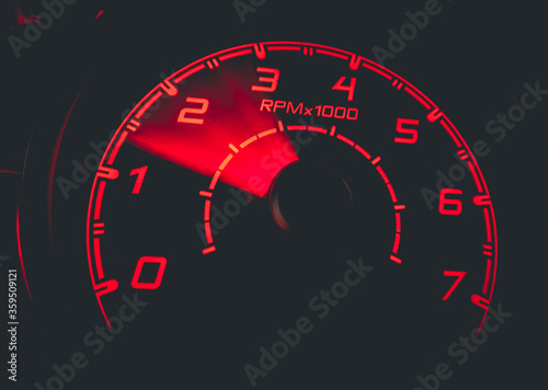 Driver's cockpit ; speedometer on dashboard - colorful light in black, copy space for your abstract design	