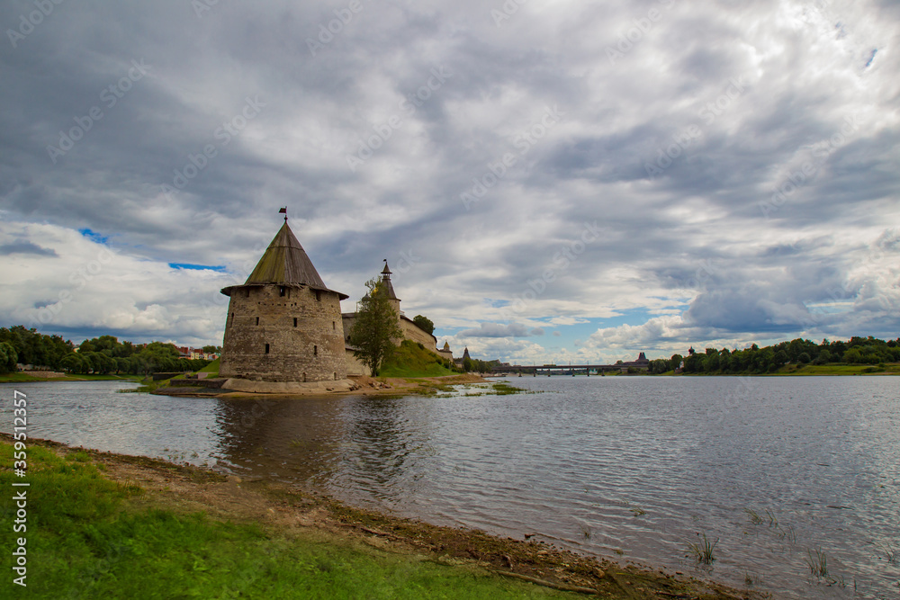 Russia. Ancient fortress in Pskov. Flat tower kutekroma tower of the Pskov fortress under the grey sky. Ancient cities of Russia. Russian sights. Ancient fortresses of Russia.