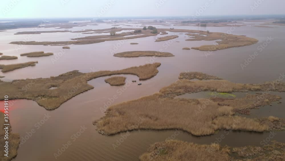 Fishing boats at the delta of Dnepr river. Drone air footage