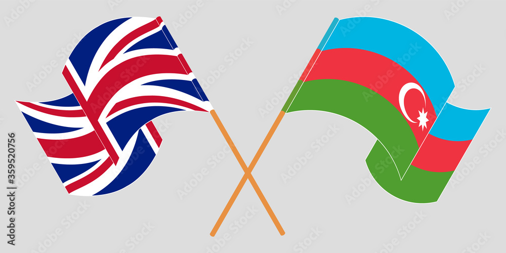 Crossed and waving flags of Azerbaijan and the UK