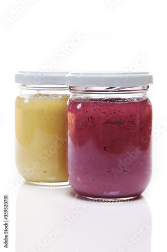 Nutrition concept - Healthy meals in glass jars over white background. Healthy take-away lunch jar. 