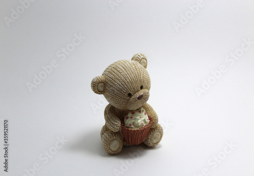 Decorative figurine bear on a white background