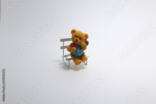 Decorative figurine bear on a bench
