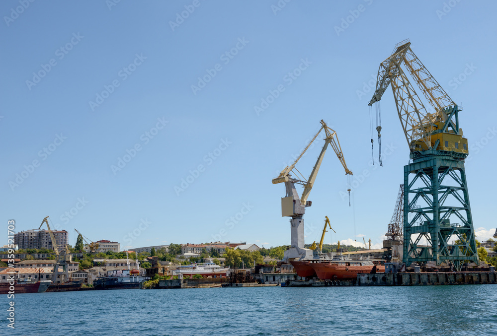 Powerful cranes are in Southern Bay seaport, Sevastopol, Crimea, Russia.