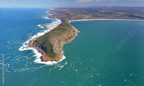 Plettenberg Bay, Western Cape / South Africa - 08/28/2017: Aerial photo of Robberg Peninsula with Plettenberg Bay in the background