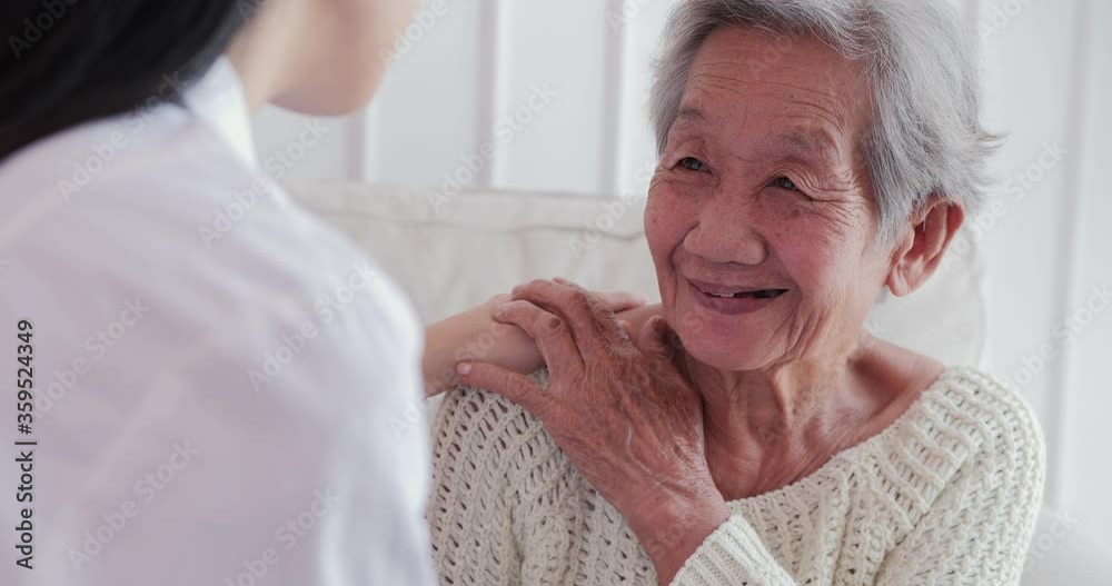 Female doctor visiting senior woman at home. Female doctor help patient at checkup medical consultation at home. elderly grandma listen caregiver giving support. healthcare and medical concept