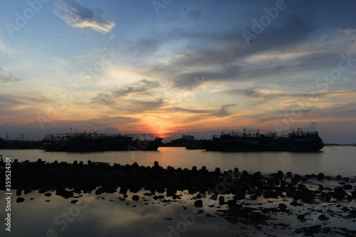 BEAUTIFUL SUNSET IN MUARA ANGKE BEACH, NORTH JAKARTA, INDONESIA