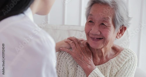 Female doctor visiting senior woman at home. Female doctor help patient at checkup medical consultation at home. elderly grandma listen caregiver giving support. healthcare and medical concept