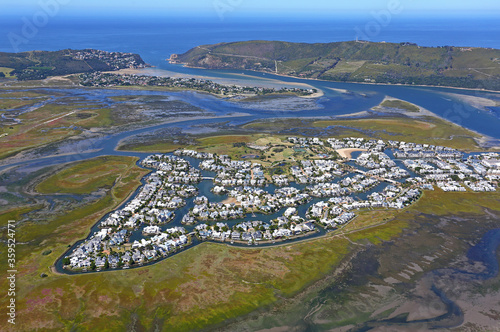 Knysna, Western Cape / South Africa - 02/05/2019: Aerial photo of Thesen Island with Knysna Heads in the background