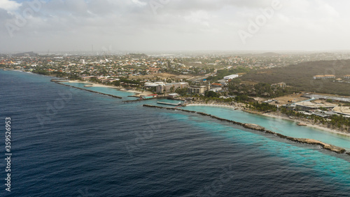 Aerial view of coast of Curaçao in the Caribbean Sea with turquoise water, cliff, beach and beautiful coral reef