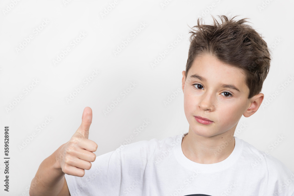 Teenage boy in white shirt. Portrait in studio. Funny faces. Teenage boy in white shirt. Portrait in studio. Funny faces.