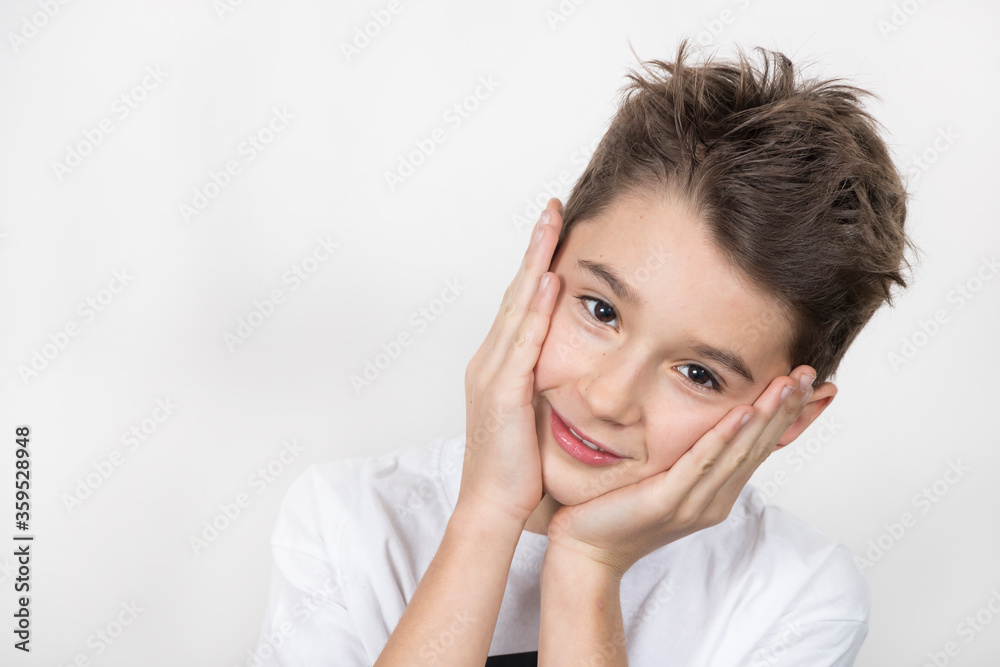 Teenage boy in white shirt. Portrait in studio. Funny faces. Teenage boy in white shirt. Portrait in studio. Funny faces.