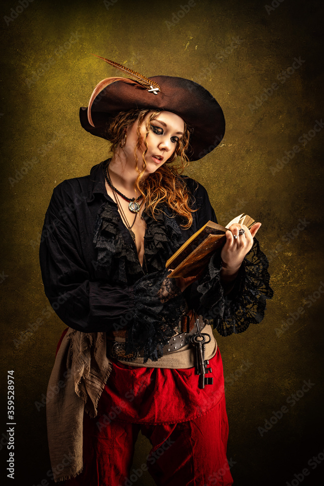 Fototapeta premium Portrait of a privateer in profile, reading a book