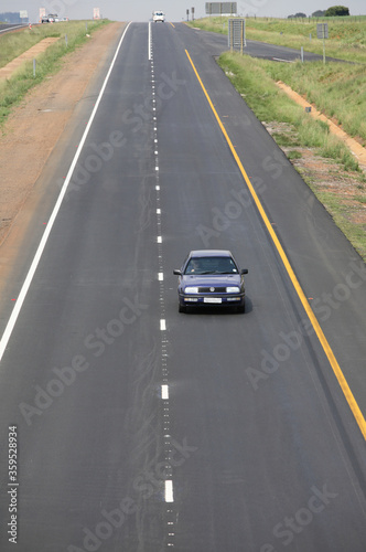 Durban, Kwa-Zulu Natal / South Africa - 11/26/2009: Aerial photo of a vehicle travelling along a road