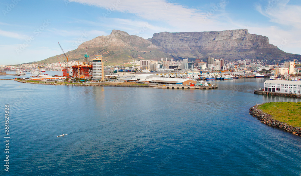 Cape Town, Western Cape / South Africa - 07/19/2012: Aerial photo of paddler leaving Cape Town Harbour with Table Mountain in the background