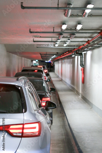 Fire extinguishing system in underground Parking. Traffic jam at entrance. Tunnel full of cars.