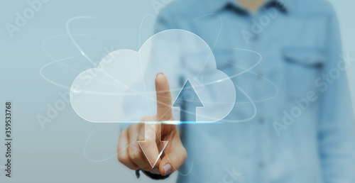 Woman Clicking At Transparent Cloud Data Storage Icon On Digital Screen