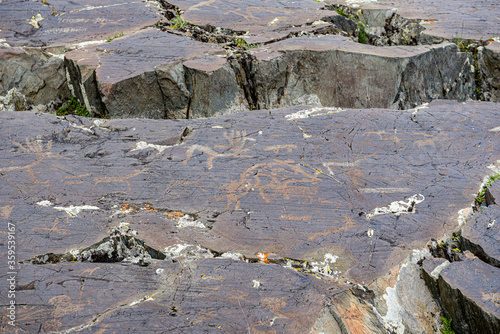 Ancient petroglyphs carved into rocks in western Mongolia, Bayan Olgii province. photo