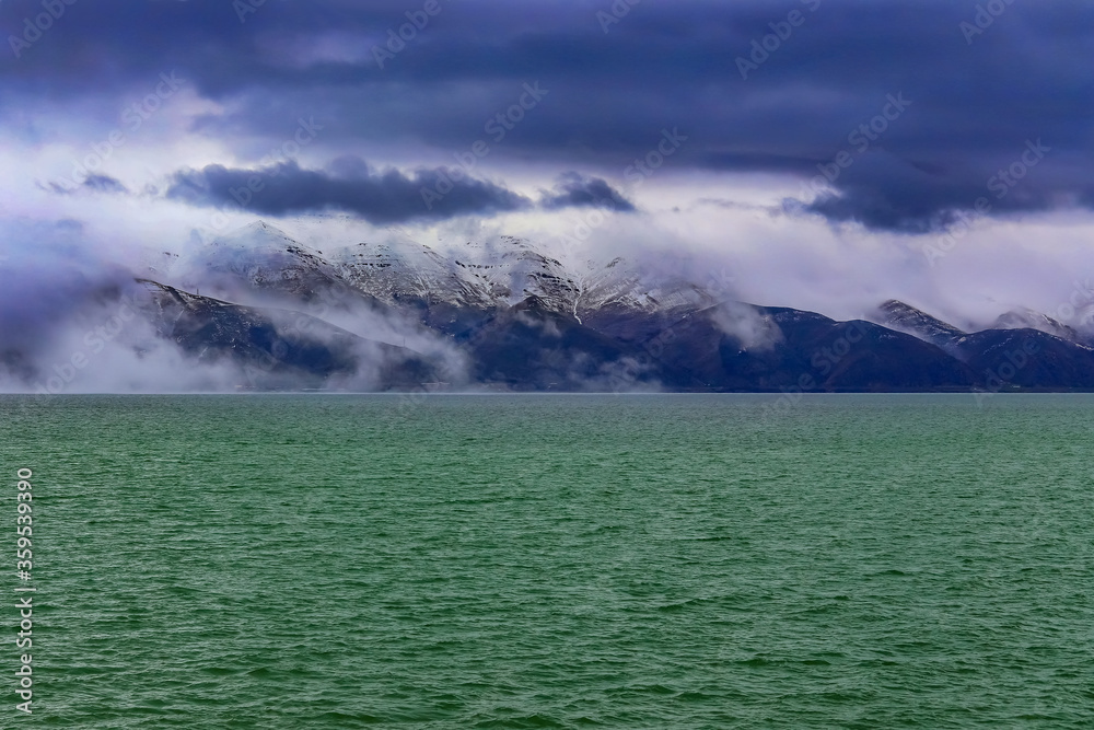 Winter Lake Sevan in Armenia in cloudy weather.