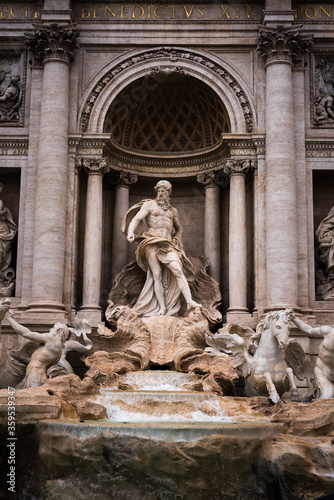 Famous statue of Neptune in the iconic Trevi Fountain in Rome