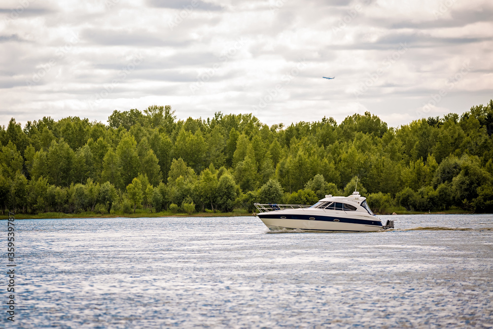 Fototapeta premium yacht is floating on the river. boat in the ocean. ship at sea