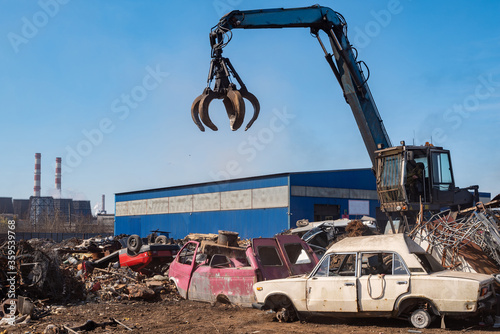 Utilization of the car. Old car at the dump of scrap metal. Utilization of the car at the dump.