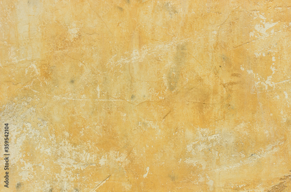 Background yellow old rusty plastered wall