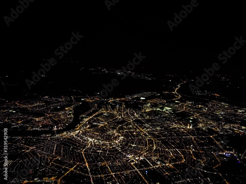 Aerial view of Amsterdam with illuminated streets at night